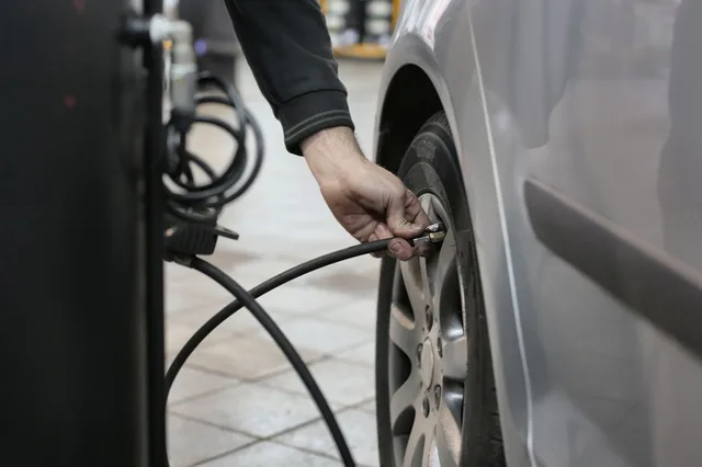 Illustrative photograph of an air hose connected to a tire valve
