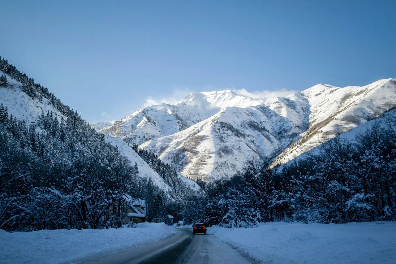 A vehicle on a snowy mountain road near Park City, Utah